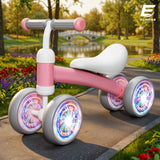 Bicicleta fara Pedale Elindor® pentru Copii, cu 4 Roti cu LED, Usoara, Silentioasa, Robusta, Sa Ergonomica, Dezvolta Echilibrul si Coordonarea, pentru Copii de 10-36 Luni, 55 x 19 x 24.5 cm, Roz