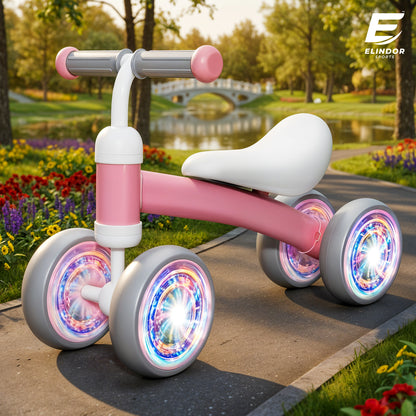 Bicicleta fara Pedale Elindor® pentru Copii, cu 4 Roti cu LED, Usoara, Silentioasa, Robusta, Sa Ergonomica, Dezvolta Echilibrul si Coordonarea, pentru Copii de 10-36 Luni, 55 x 19 x 24.5 cm, Roz