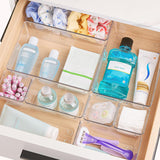 Organizator de sertar transparent pentru produse de igienă personală, cosmetice și accesorii.