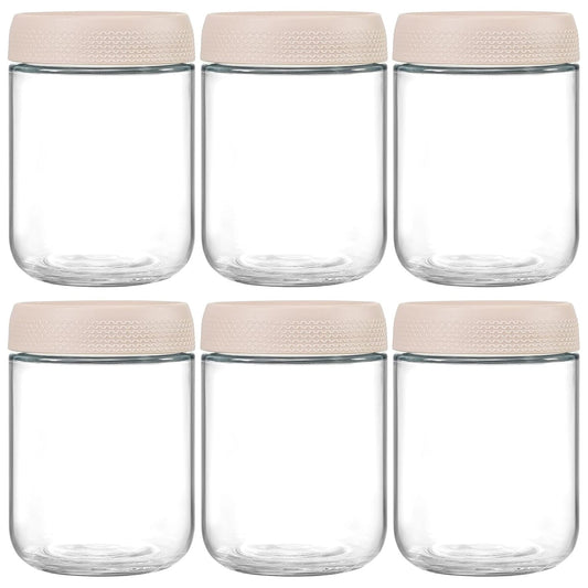 Set de 6 borcane din sticlă transparentă, cu capac din plastic bej, ideale pentru depozitare.